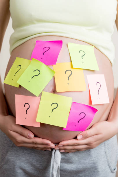istock Pregnant woman belly with question mark. Pregnancy and thinking problem 1620893476