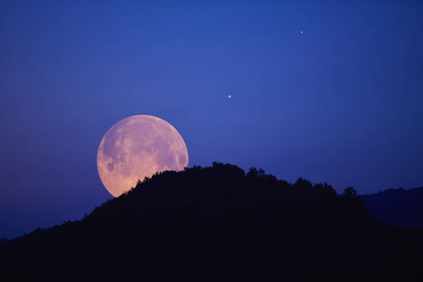 istock Full Moon, stars, planets and landscape scenery silhouettes. 1620895707