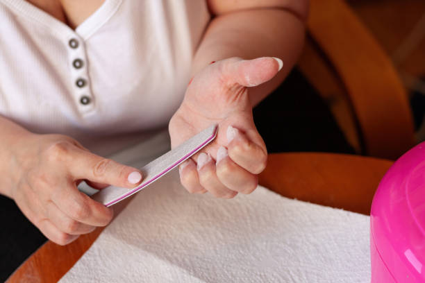 istock Female hands during manicure procedure 1620898140