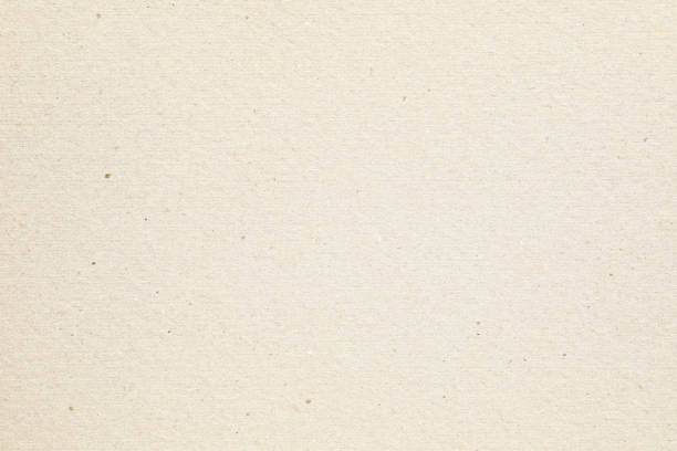 istock Yellowed beige paper with grainy texture 1620905221