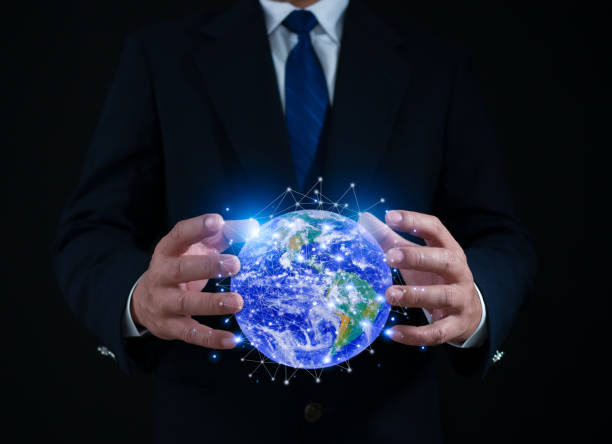 istock Businessman holding virtual global communication network. Business global internet connection application technology and digital marketing, Financial and banking, Digital link tech, big data. element of NASA, https://earthobservatory.nasa.gov/images. 1620913750