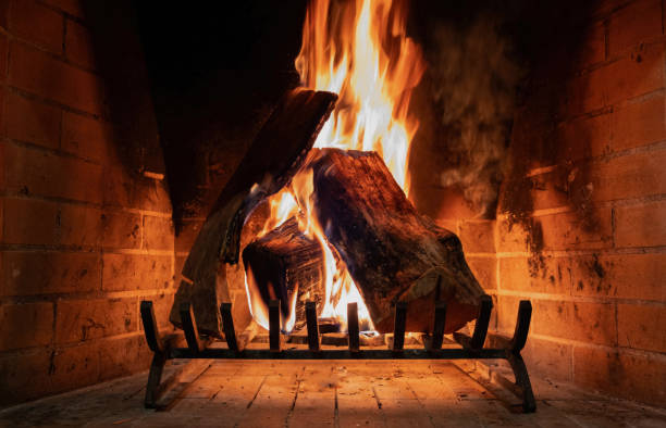 Fireplace close up, fire flame and burning wood log, warm home in winter Fireplace close up, fire flame and burning wood logs, warm home in winter, front view outdoor fire stock pictures, royalty-free photos & images