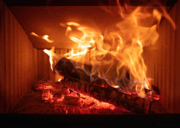istock Fire flames and burning wood logs, fireplace close up, 1620913830
