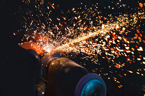 Hot sparks at grinding steel material
