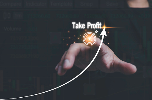 businessman finger touching target icon with text Take Profit  concept targeting profitable in stock market