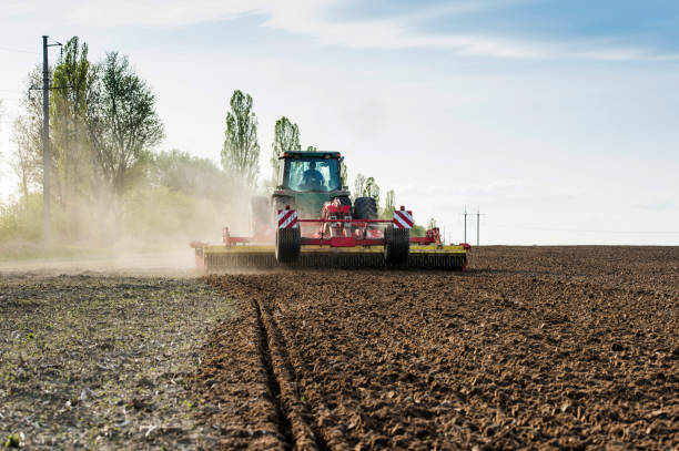 istock tractor during sowing in an open field on a sunny day 1620924482