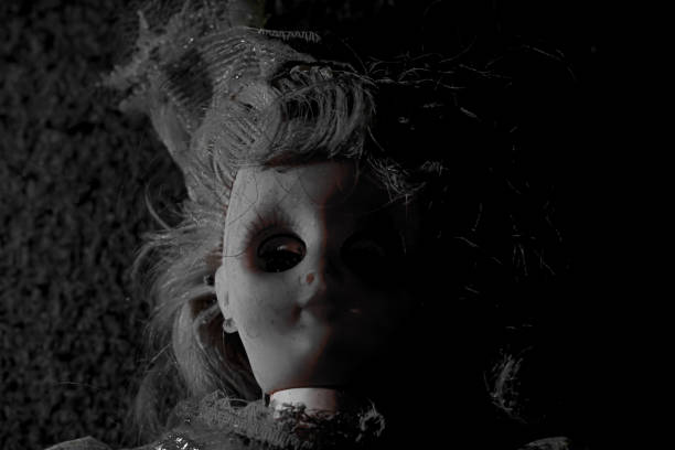 istock Vintage evil spooky doll in the darkness. 1620925073