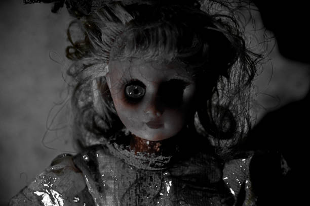 istock Vintage evil spooky doll in the darkness. 1620925649