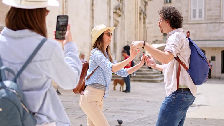 Young Woman Filming Her Two Friends Dancing In Dubrovnik