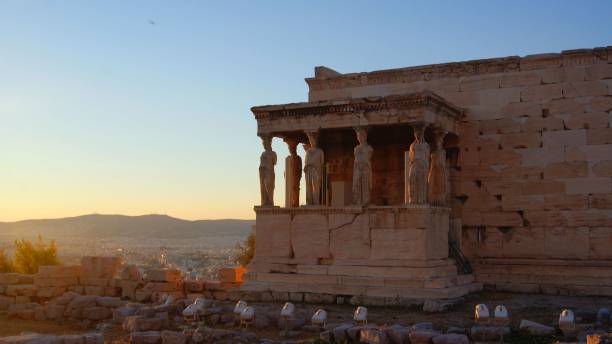 The ancient Caryatids of Athens on Acropolis hill in the evening