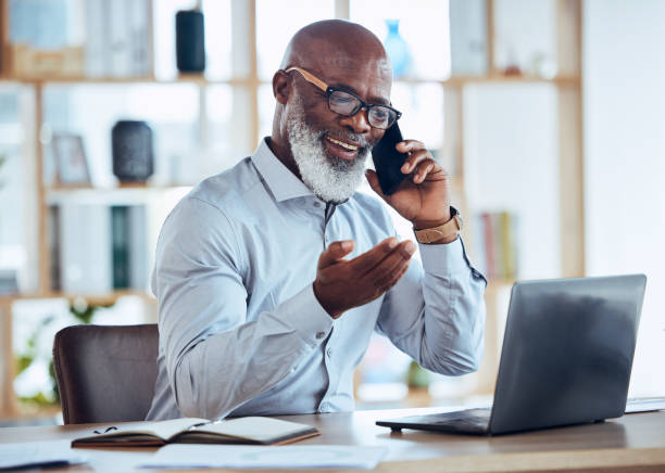 istock Happy black man, laptop or phone call in corporate networking, negotiation or client rapport on finance loan deal. Smile, talking or ceo businessman on mobile communication technology or conversation 1620956563