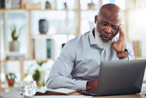 istock Stress, headache and frustrated black man on laptop in office with 404 technology glitch, crisis or online problem. Business, burnout and computer mistake with anxiety, confused or stock market crash 1620957103