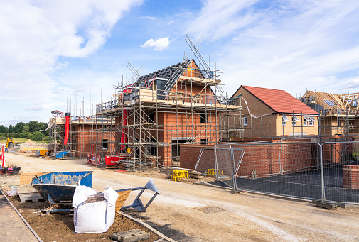 New build houses nearing completion at a housing development in the south of England.