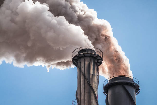 Dirty smoke from industrial chimneys
