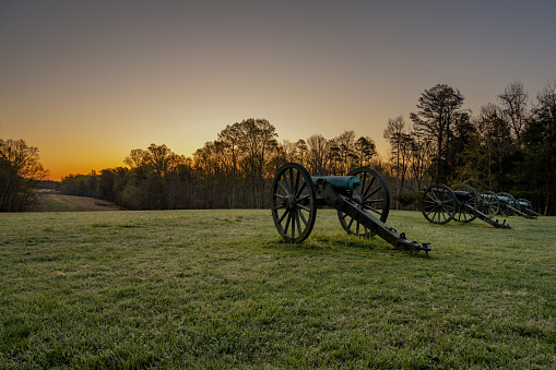 Civil war cannons in a Virginia field in the early morning
