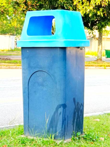 istock Selective focus of a blue dustbin at the roadside 1620992898