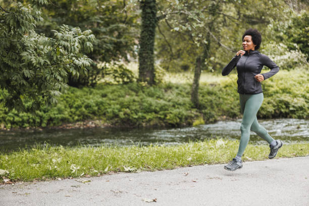 istock Black Woman Jogging In Nature 1621020597