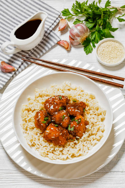 istock Baked Honey Sesame Chicken with brown rice 1621028806