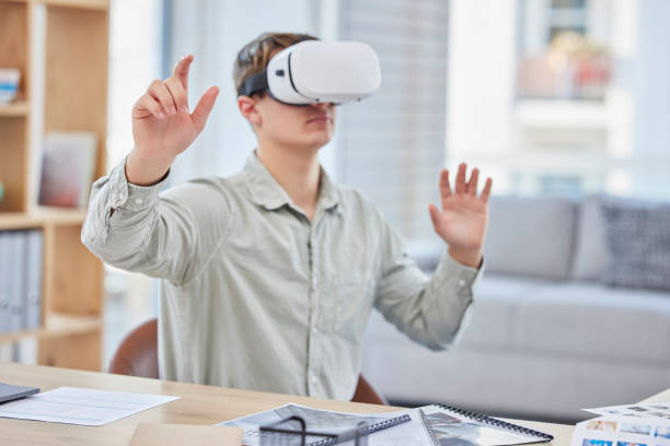 istock Vr, virtual reality and business man in office exploring metaverse with digital technology. 3d, cyber ai and male employee with futuristic headset for gaming, internet browsing or fantasy simulation. 1621038076