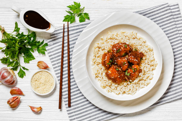 istock Baked Honey Sesame Chicken with brown rice 1621042067