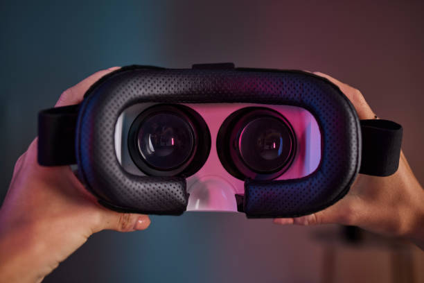 istock Virtual reality glasses in hands, metaverse and future technology, video gaming and UX with woman and cyber space. Innovation, digital world and VR headset with AR, software and female gamer 1621044230