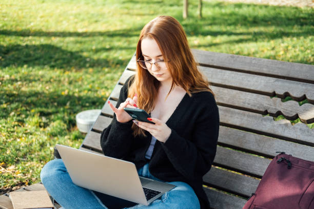 istock Artificial Intelligence AI in education industry. Applications of Artificial Intelligence and chatbots in Education. Student girl with laptop using chatbot for studying process 1621046440