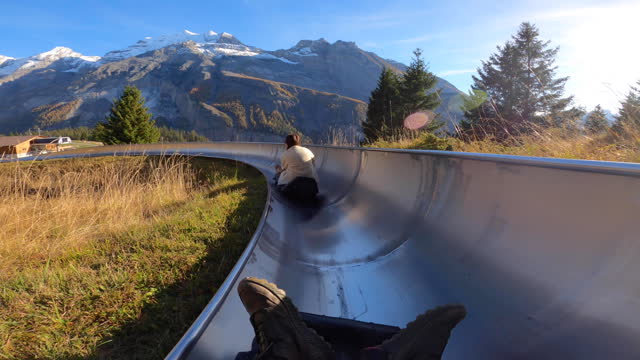 Tourist enjoying Mountain Coaster in Switzerland
