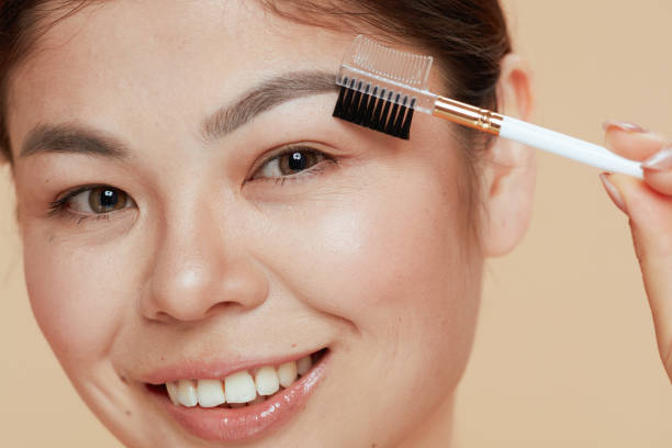 istock modern woman with brow brush 1621092959