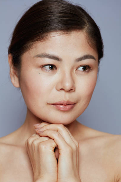 istock young asian female on blue 1621092967