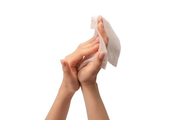 istock Wet wipe in a woman hand isolated on a white background. 1621094681