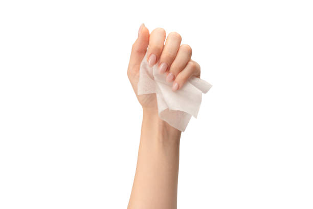 istock Wet wipe in a woman hand isolated on a white background. 1621094683