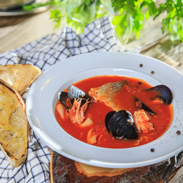istock seafood tomato soup in a white plate with toasted bread 1621108928