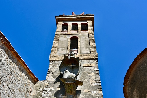 bell tower of the Eglise de l'Annonciation (Annunciation Church), the oldest building (1450) in the village of Corte; Corte, France
