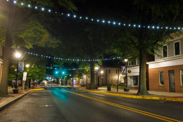 istock Nighttime charm on W Loockerman St: Dover, DE Downtown streets leading to horizon. 1621130716