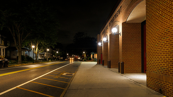 Fire Department building on W Reed St in Downtown Dover, DE at night. Diminishing perspective.