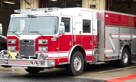 Indianapolis, IN, USA-March 17,2009:Fire Fighters of Lawrence Twp. Fire Department with Fire Truck greets people at St Patrick Day Parade