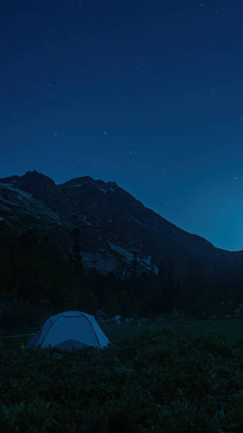 istock Camping in the forest. Beautiful night sky 1621157550