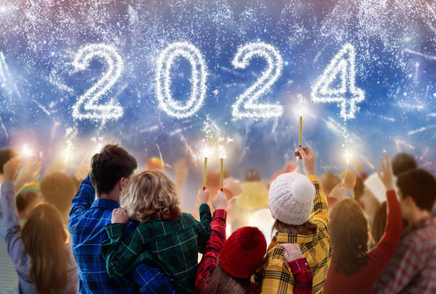 happy new year. family watching fireworks. - group of people teenager snow winter imagens e fotografias de stock