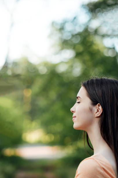 istock Practice Self-Care Outdoors. Connection to Nature into Daily Routine. Ground Yourself by Connecting with the Earth. Outdoors portrait of young woman enjoying nature 1621167086
