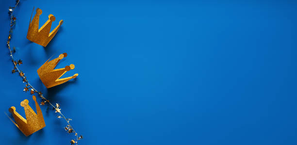 istock Happy Epiphany Day, Three Kings Day greeting card with three gold crowns on blue background. Concept for Dia de Reyes Magos day, three Wise Men, Epiphany Christian feast day 1621177371