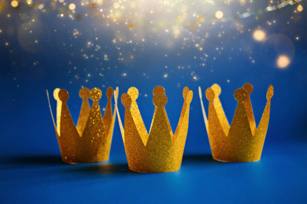 istock Happy Epiphany Day, Three Kings Day greeting card with three gold crowns on blue background. Concept for Dia de Reyes Magos day, three Wise Men, Epiphany Christian feast day 1621177377