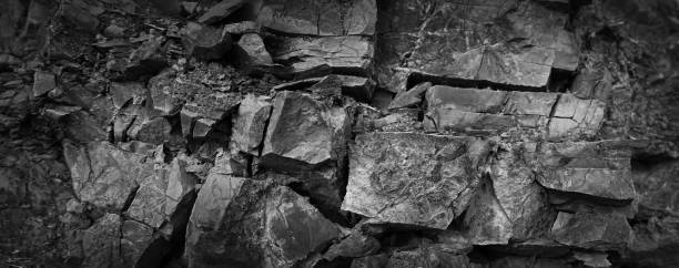 istock Black white dark gray stone rock texture background for design. Grunge. Cracked mountain surface. 3d. 1621201535