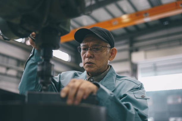 istock Senior Industrial Worker Working At Factory 1621204251