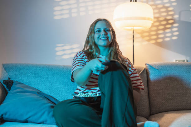 istock Young woman watching TV 1621251164