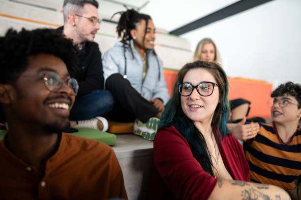 istock Students or coworkers talking at auditorium 1621255483