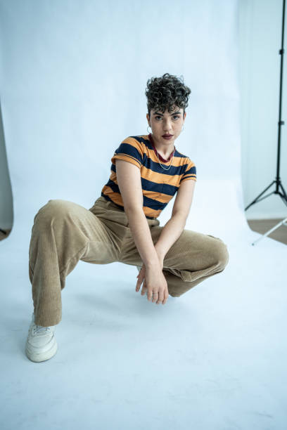 istock Portrait of a young model woman crouched at studio 1621262432