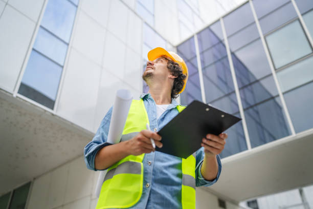 istock architect man construction engineer worker or inspector stand outdoors 1621268786