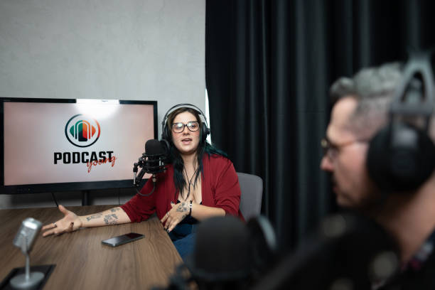 istock Young woman talking during a interview at podcast 1621278566