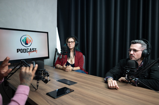 Group of people talking during a interview at podcast
