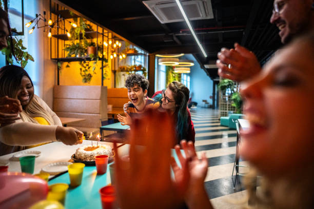 istock Coworkers clapping during a birthday office party 1621289262